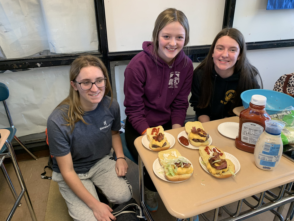 Students with their creations for the burger challenge