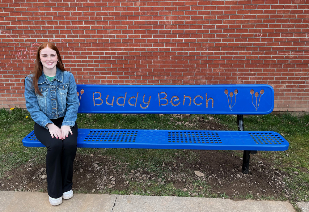 Walton CSD's Eve Foster sits on the new buddy bench  at Townsend