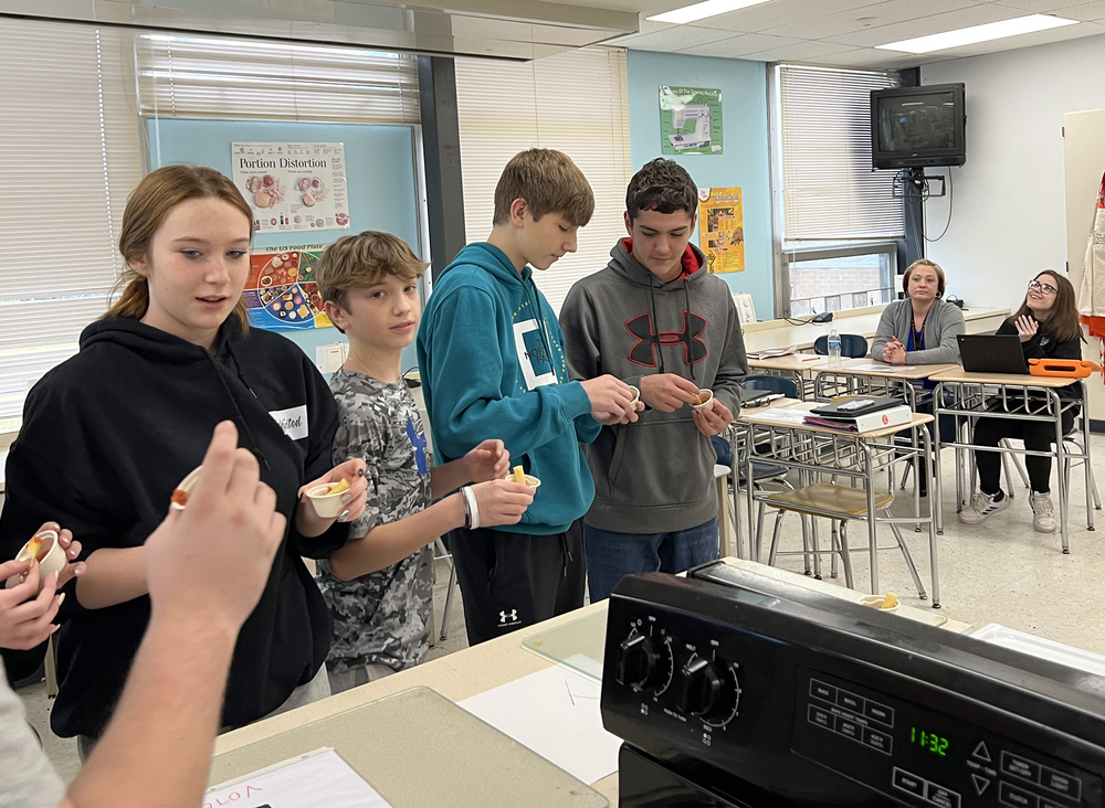 Students tasting the sauce