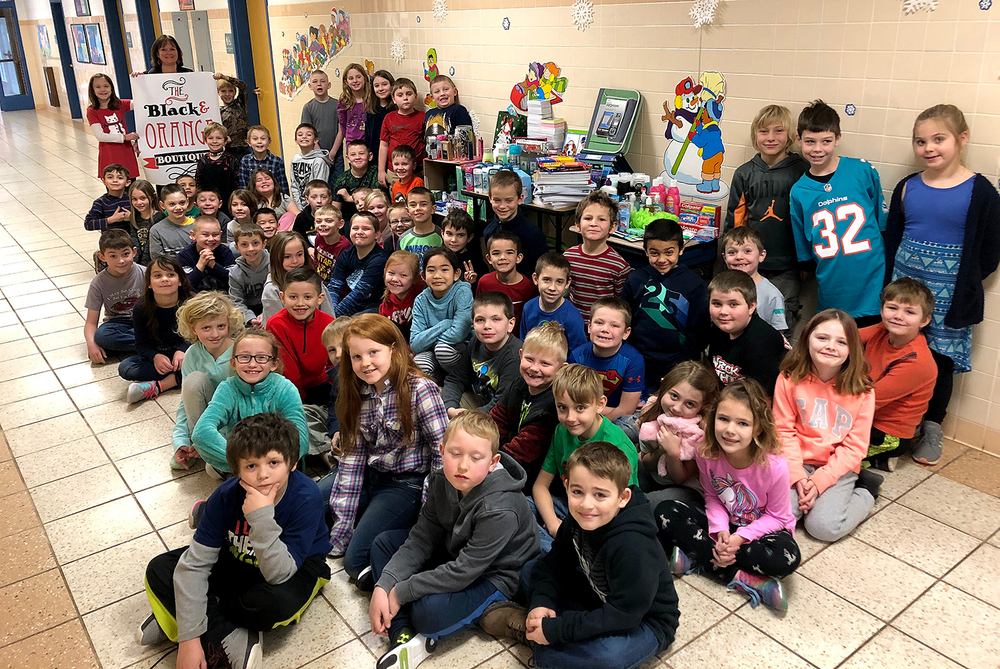 Second graders give to Black and Orange Boutique