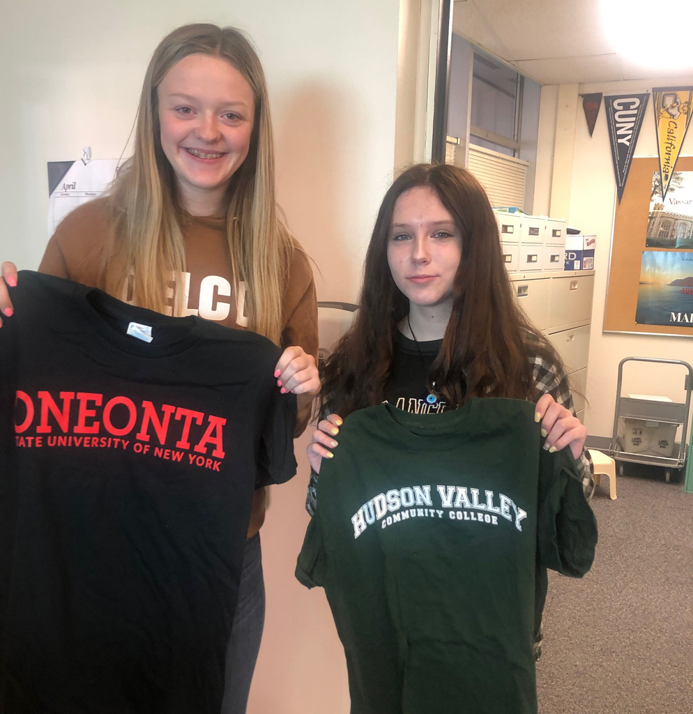Students showing off college shirts