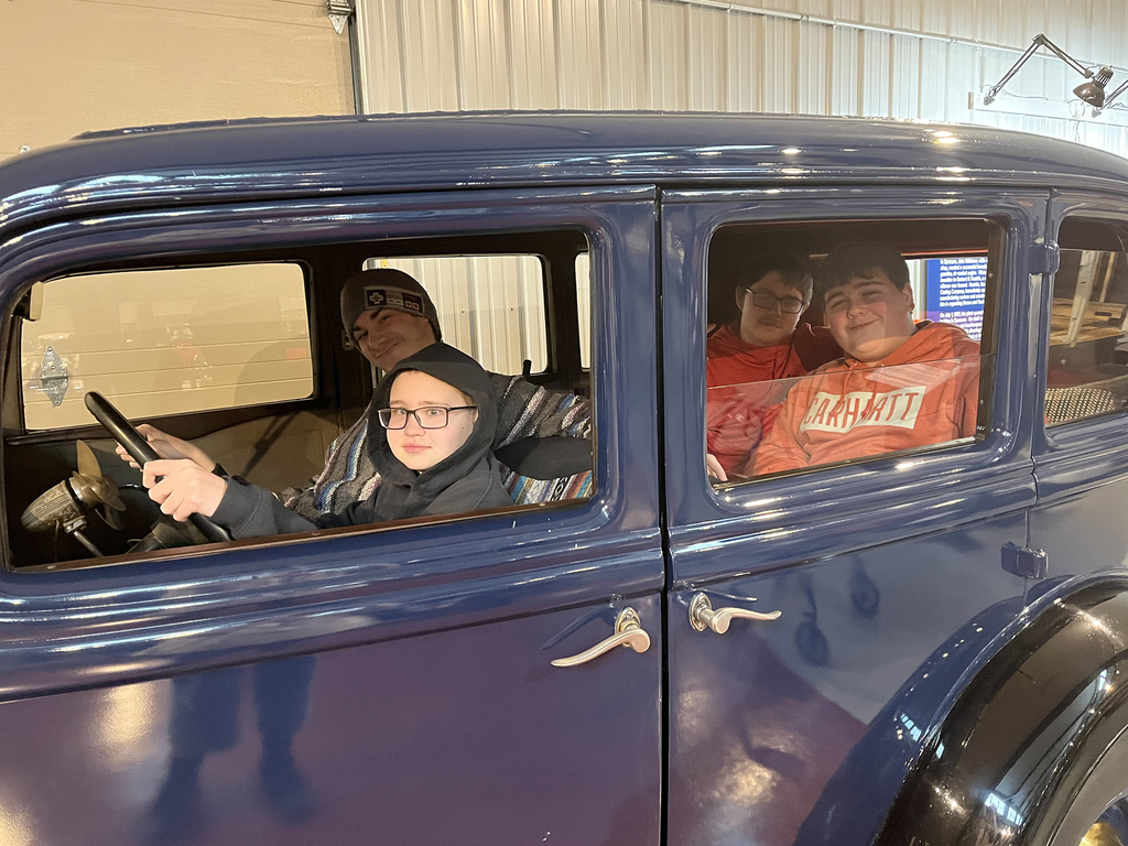 Students at the car museum. 