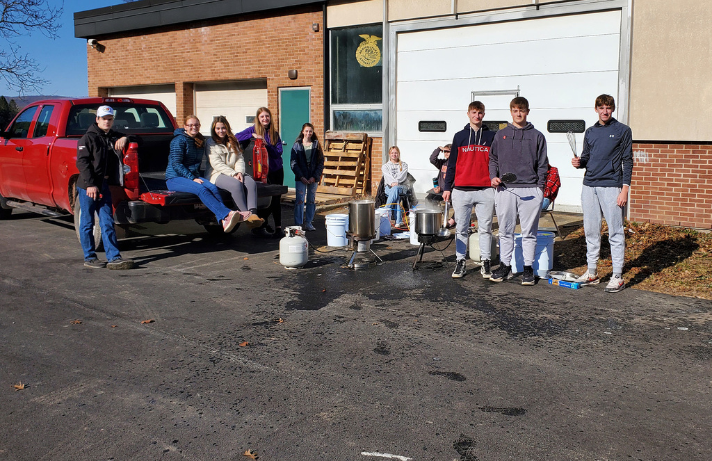 Students in Environmental Science class working on maple syrup project