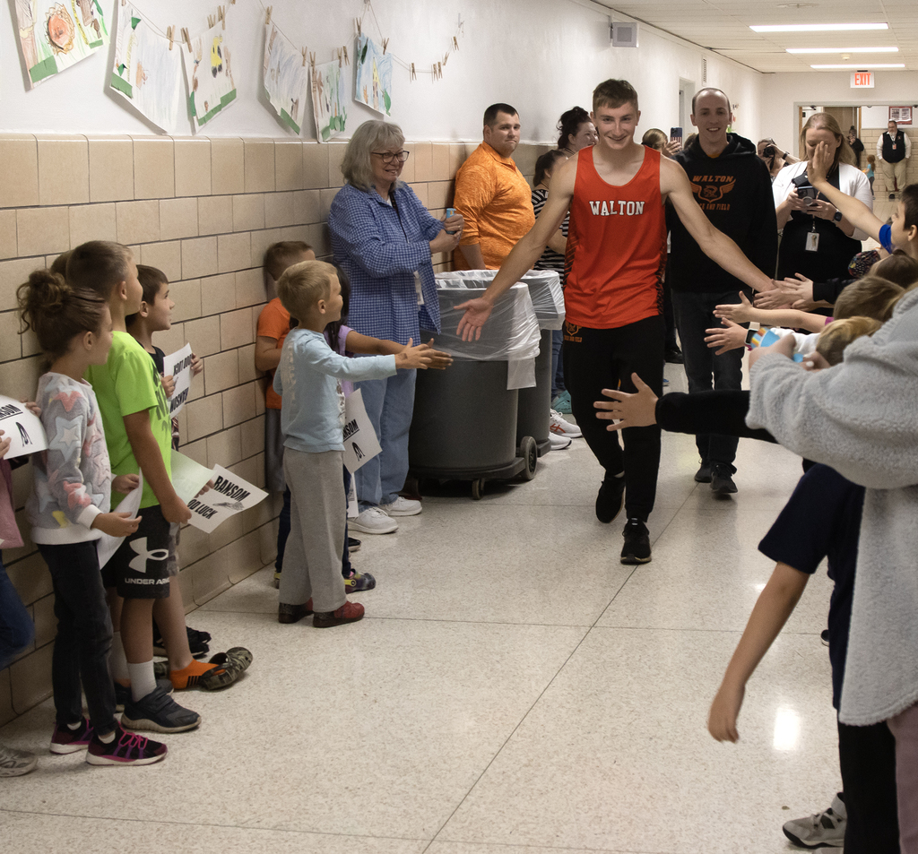 Ransom Dutcher walks through Townsend Elementary